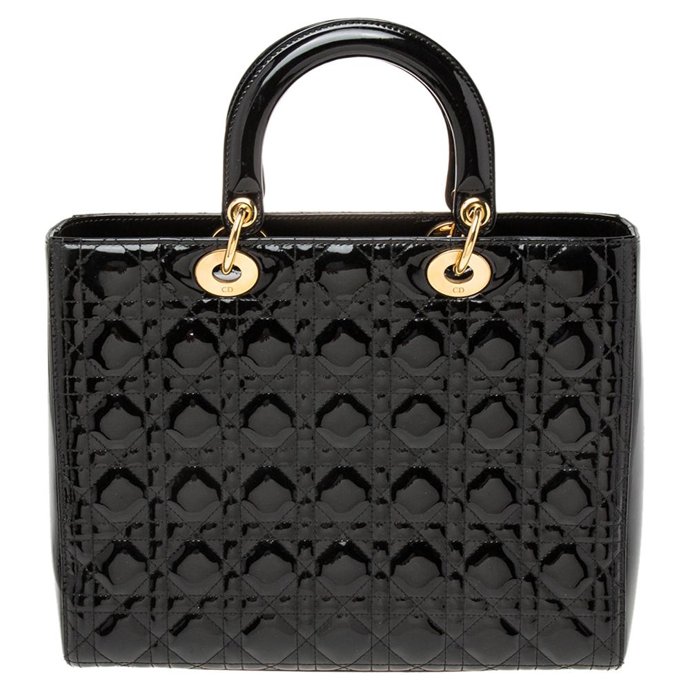 The Lady Dior tote is a Dior creation that has gained recognition worldwide and is today a coveted bag that every fashionista craves to possess. This black tote has been crafted from patent leather and it carries the signature Cannage quilt. It is