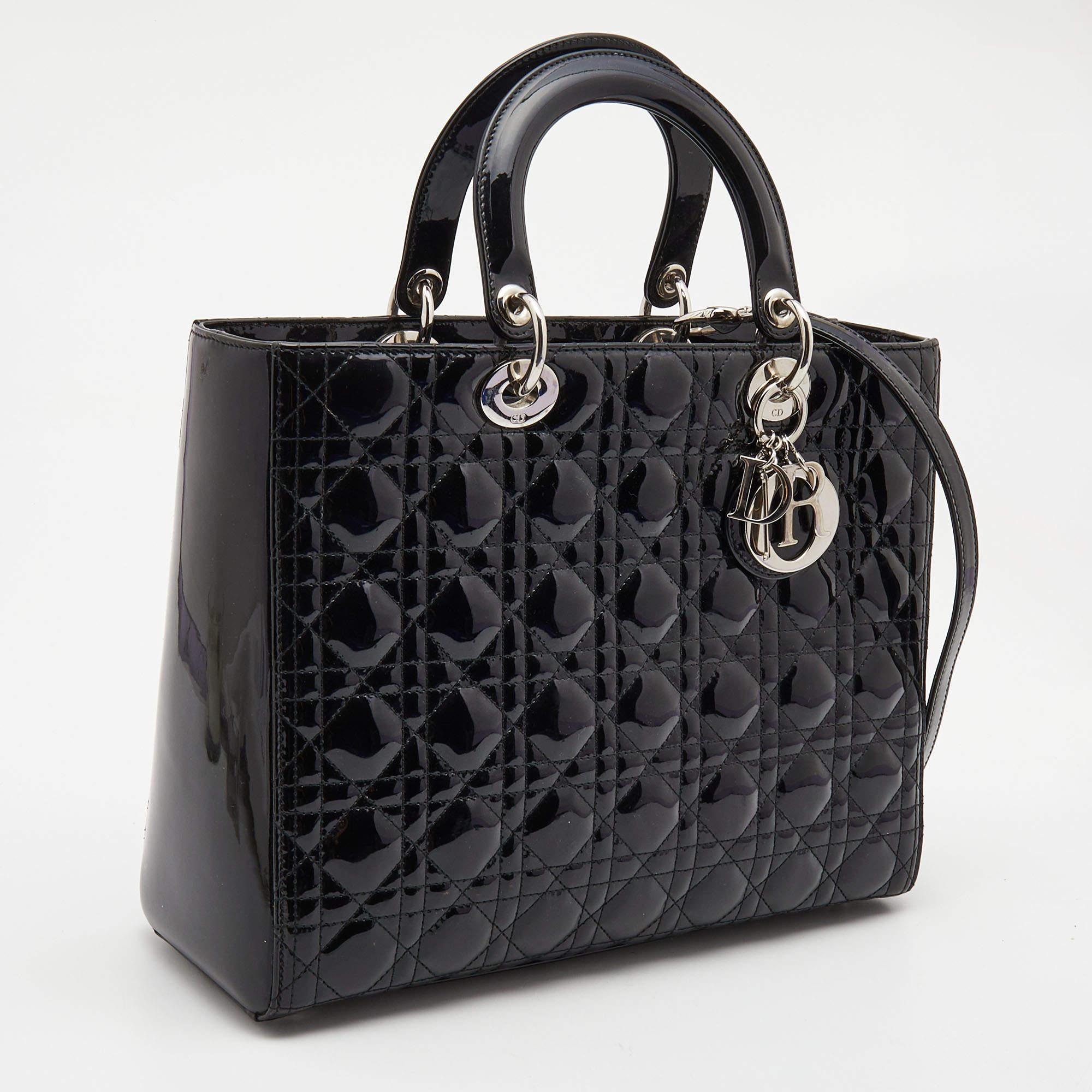 A timeless status and great design mark the Lady Dior tote. It is an iconic bag that people continue to invest in to this day. We have here this classic beauty crafted from black Cannage patent leather. The bag has a lined interior for your