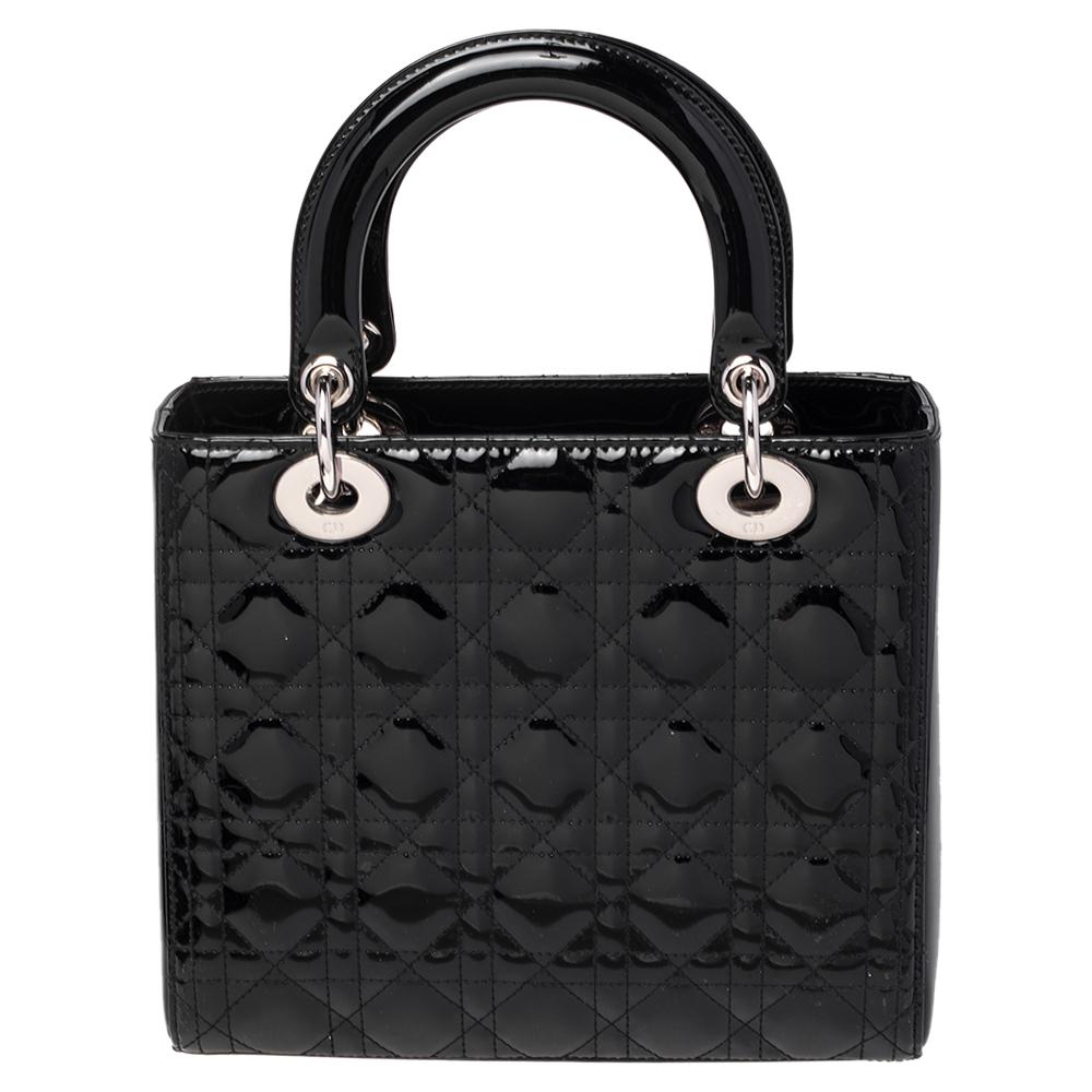 Named in honor of the late Lady Diana, Princess of Wales, the Lady Dior tote has been the most iconic tote designed by the house. The tote constitutes a black patent leather exterior with silver-tone hardware that carries the signature silver