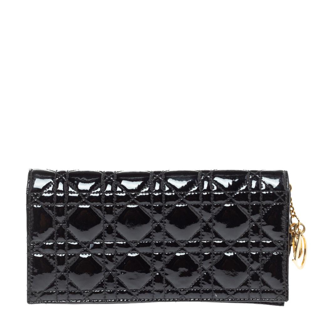 Lady Dior is a Dior creation that has gained recognition worldwide and is today a coveted bag that every fashionista craves to possess. This black chain clutch has been crafted from patent leather and it carries the signature Cannage quilt. It is