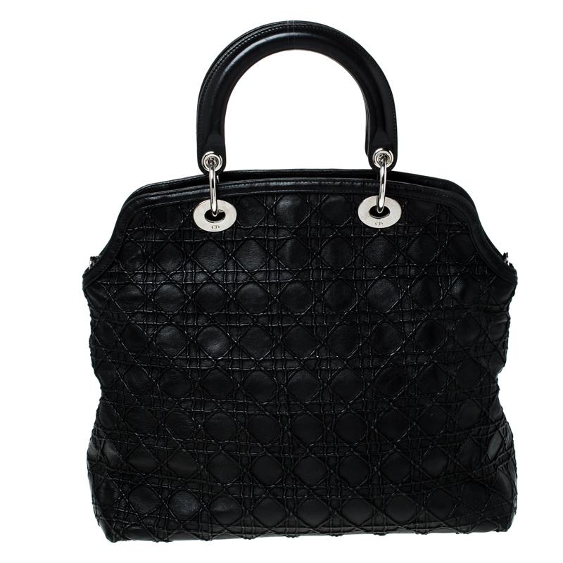 This chic and feminine Granville tote is from Dior. The bag is crafted from Cannage quilted leather. Black in colour, it is easy to carry around. It features dual handles with the signature 'DIOR' accents and protective metal feet. The interior is