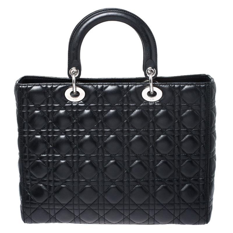 The Lady Dior tote is a Dior creation that has gained recognition worldwide and is today a coveted bag that every fashionista craves to possess. This black tote has been crafted from leather and it carries the signature Cannage quilt. It is equipped