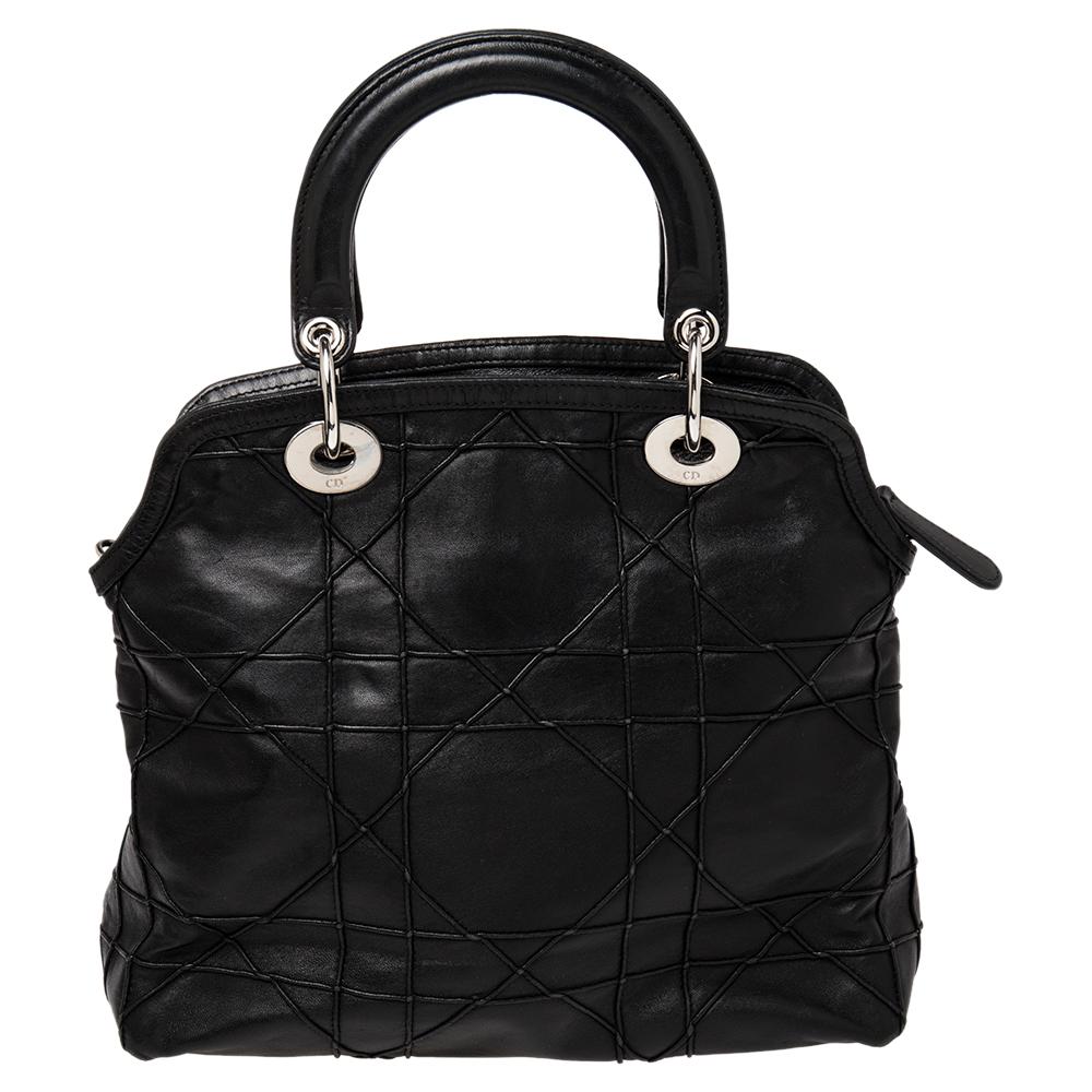 This chic and feminine tote is from Dior. The bag is crafted from leather and it features their signature Cannage quilt and two top handles. The bag has an interior sized to fit your daily essentials and lastly, it is complete with protective metal