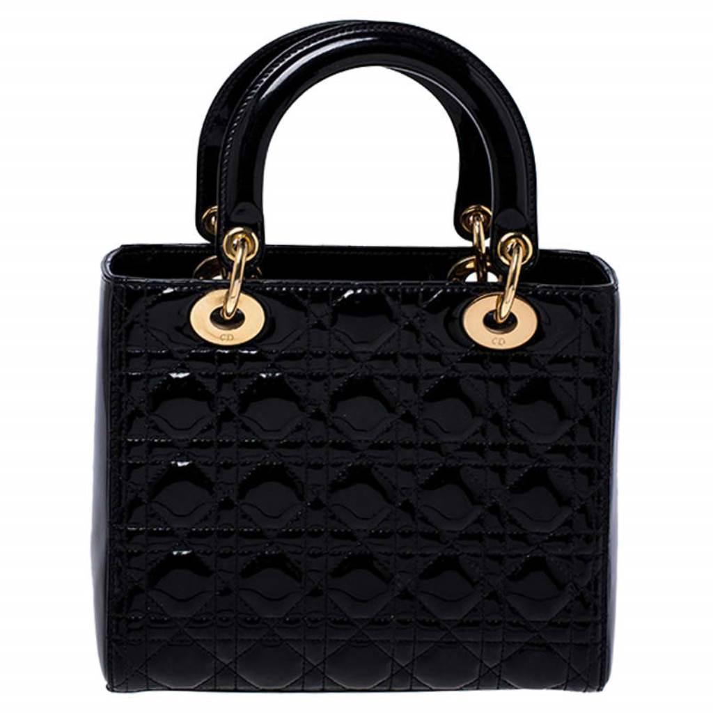 The Lady Dior tote is a Dior creation that has gained recognition worldwide and is today a coveted bag that every fashionista craves to possess. This black tote has been crafted from patent leather and it carries the signature Cannage quilt. It is