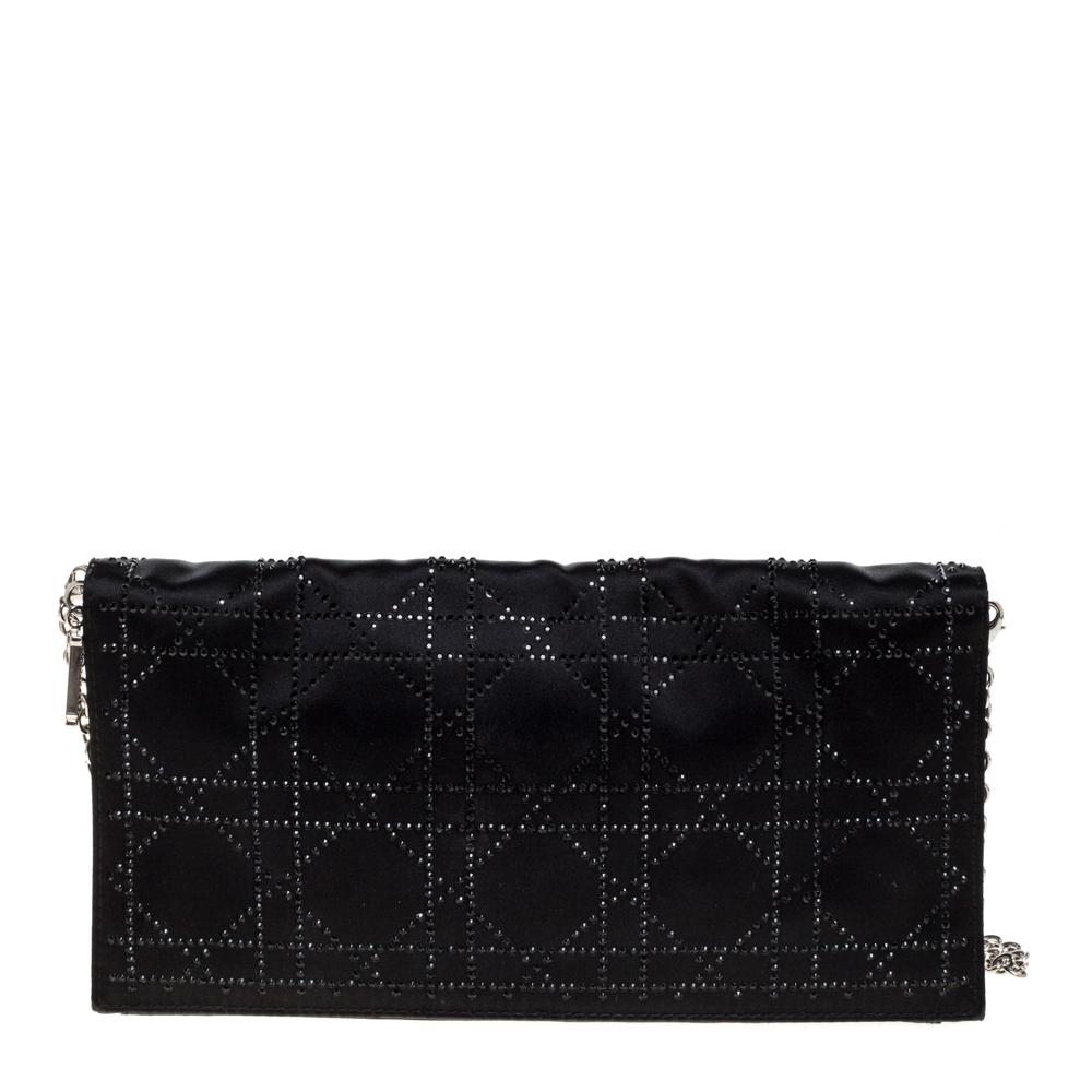 Whether going out for drinks or a casual outing, this clutch from Dior is the perfect way to add a little style to your look. It comes crafted in satin featuring the signature cannage pattern and crystal embellishments on th exterior, and a