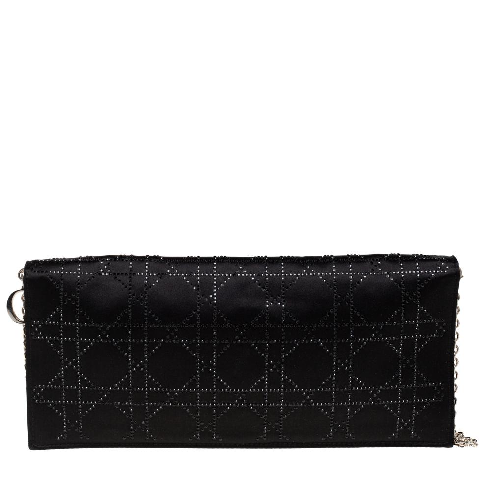 Dior has always been a favorite of countless women when it comes to owning stylish bags. This black clutch is one such creation. It is crafted from satin and features a crystal embellished cannage pattern on it. It flaunts a front flap closure, a