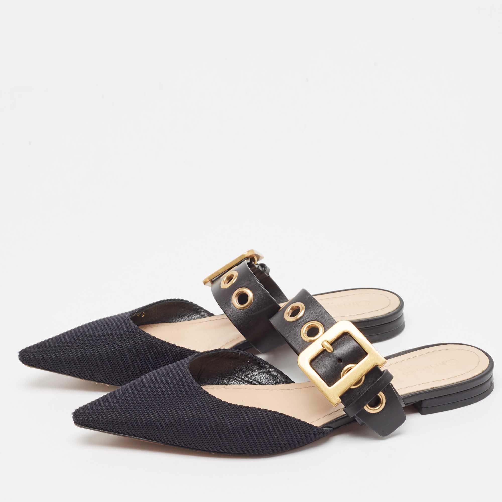 Elevate your look without compromising on comfort when you slip into these Dior mules. Made from canvas & leather, the mules are perfect for any occasion and will leave you feeling confident each time you slip them on.

