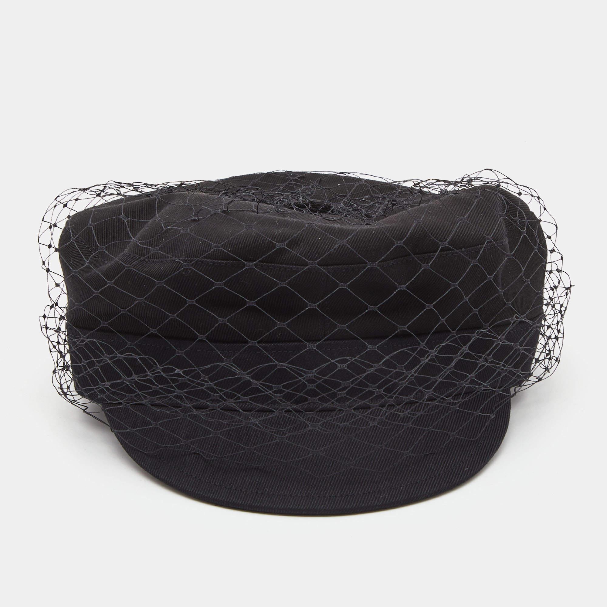 Let style rule your daily wardrobe. Dior brings this extremely chic cap crafted out of lightweight cotton, with a mesh veil covering it all over and the brand logo at the rear. A must-have accessory indeed!

