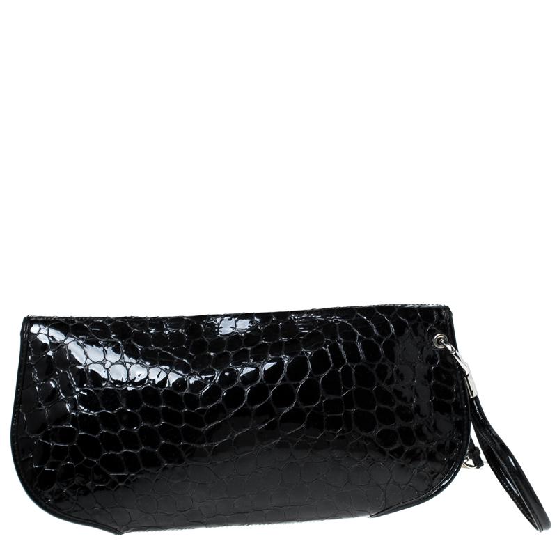 Dior never disappoints! The mega fashion house brings you yet another gorgeous accessory with this clutch. It has been crafted from crocodile patent leather and shaped beautifully. The flap opens to reveal a fabric interior and the black clutch is