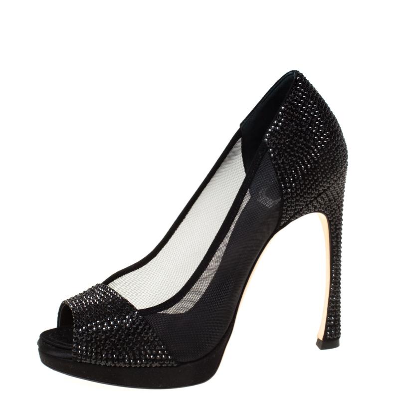 It is easy to fall in love with these pumps by Dior! They've been beautifully crafted from crystal-embellished satin and mesh and designed with peep toes, platforms and 12.5 cm heels. The pumps are sure to complement all your dresses and evening