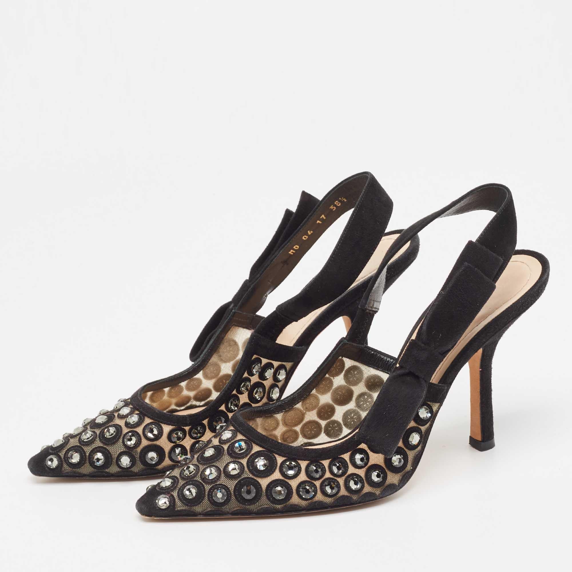 This pair of Dior pumps celebrates femininity like all other designs of the brand. Made from suede and mesh, the creation is decorated with crystal embellishments and the sharp silhouette is balanced on 10cm heels.

