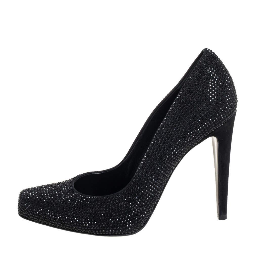It is easy to fall in love with these pumps by Dior Theyve been beautifully crafted from suede in a black shade and designed with almond toes  embellishments  and high heels. The pumps are sure to complement all your dresses and evening gowns
