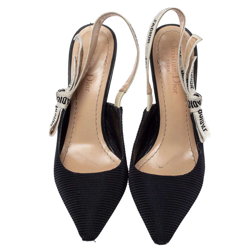 These popular J'Adior pumps exude an elegant and sophisticated aesthetic. Crafted from fabric in a black shade, the sandals have a sleek design with pointed toes. Adorned with slingbacks featuring the iconic 'J'Adior' wording and 11 cm heels, these