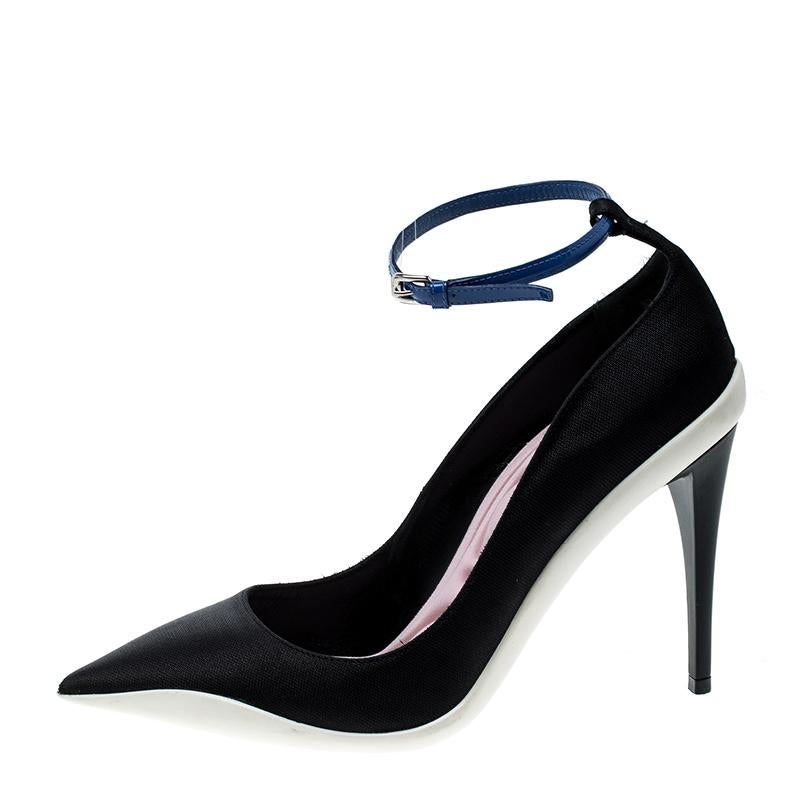 These pumps from the house of Dior are equal parts fun, functional and chic. Set on low-lying slender heels, this pair comes with a pointed-toe and secured with contrasting ankle strap closure with a buckle. It comes fitted with a cushioned fabric