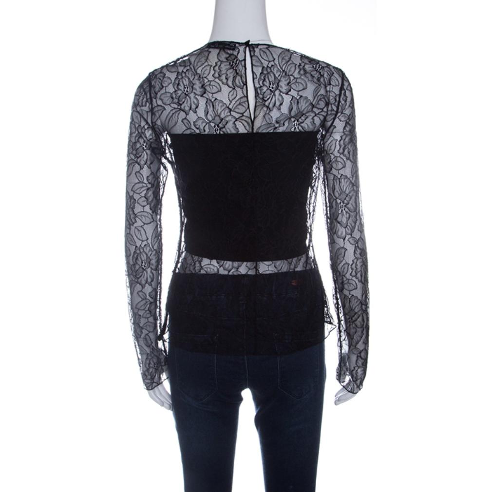 There is something incredibly chic, feminine and flattering about lace just like this Dior top. It features a floral lace body with full sleeves and shows just the right amount of skin. It features a rounded neckline and secured with a hook closure