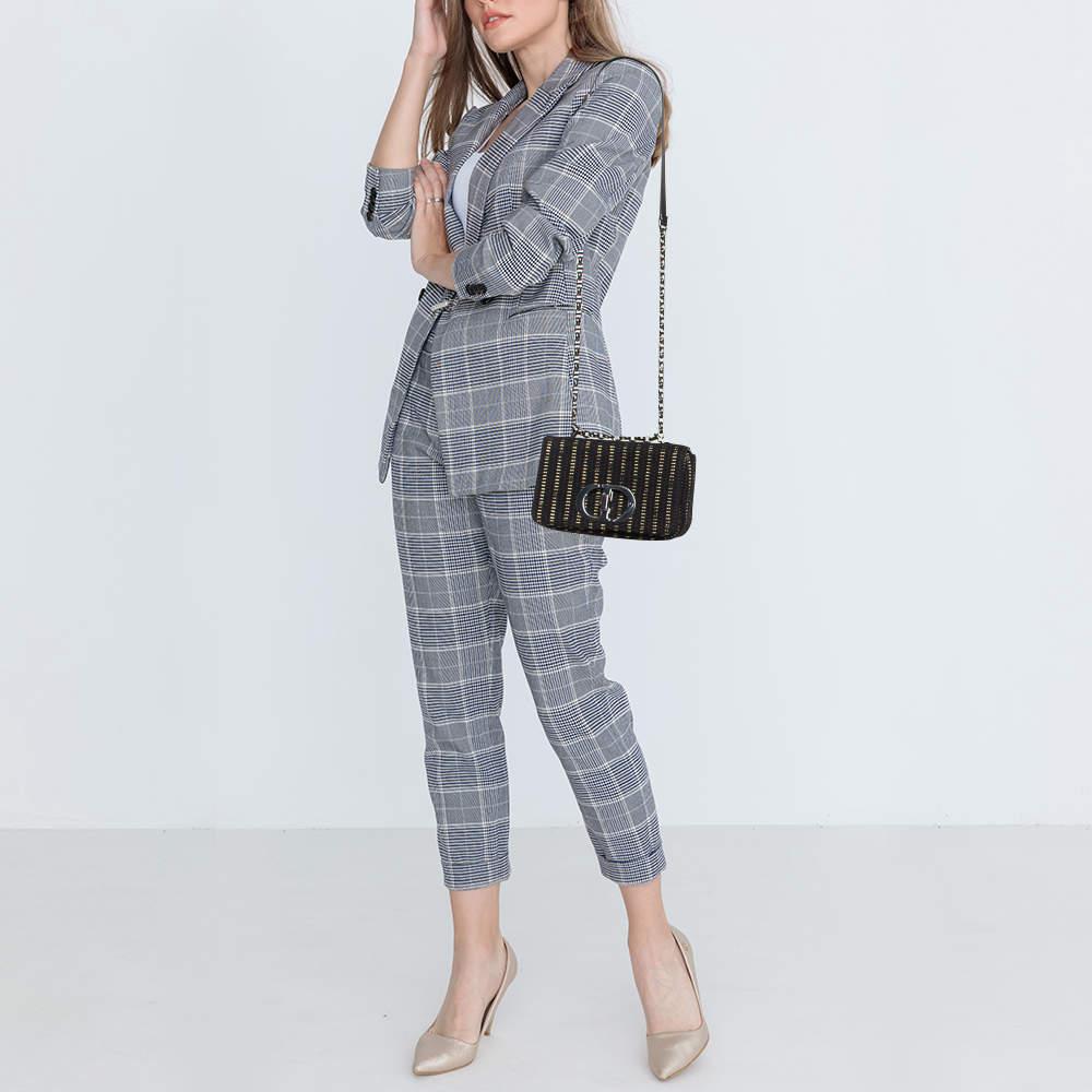 Dior ensures you have a wonderful accessory to accompany you every day with this well crafted bag. It has a signature look and a compact size.