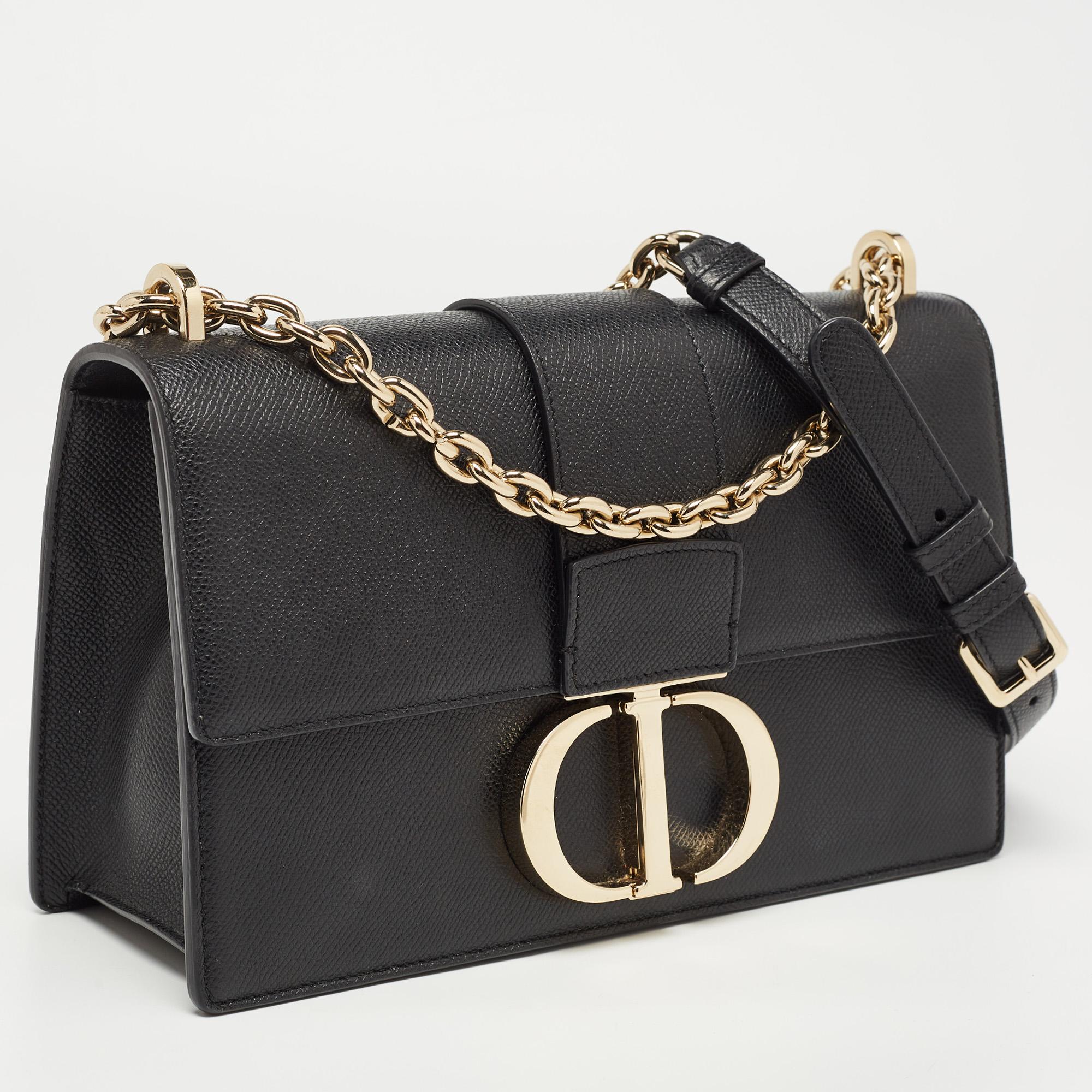 Elevate your style and have your essentials with you as you carry this authentic Dior bag. Crafted using leather, the bag has a sliding chain handle, the CD logo on the front, and a lined interior.

Includes: Original Dustbag, Authenticity Card,