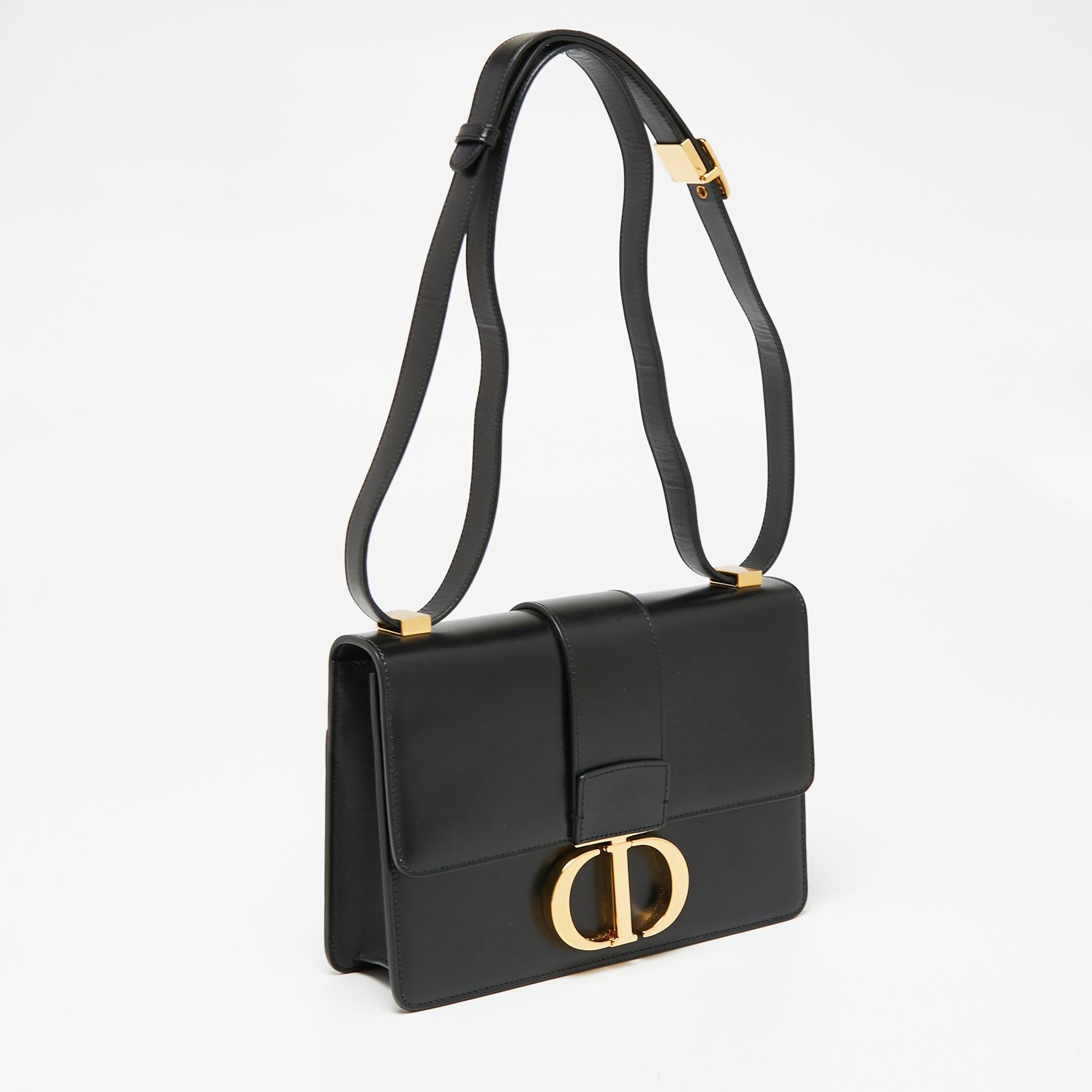 Inspired by the House's hallmark address, this Dior 30 Montaigne shoulder bag is the true embodiment of grace and luxury. The bag features a black leather exterior and a gold-toned CD metal clasp on the front that derives its design from the seal of