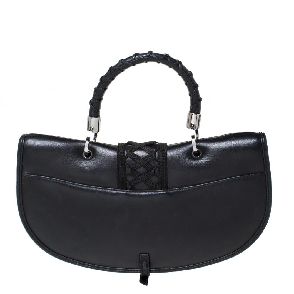 A lovely silhouette and gorgeous details make this Admit It handbag from Dior a covetable piece that you must splurge on! It is made black leather and two zippers, a woven trim and, a logo-detailed lock on the front flap. The bag opens to a