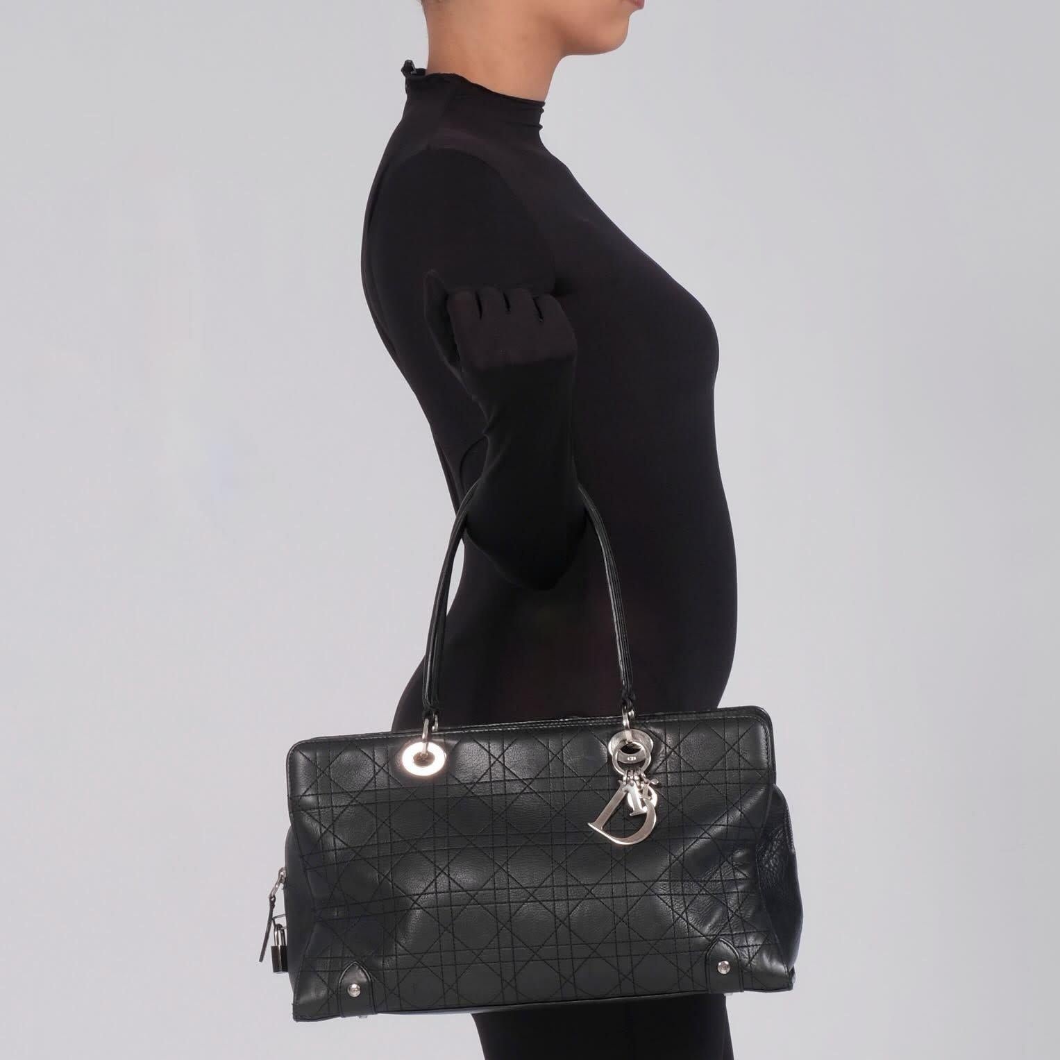 Color: Black
Material: Calfskin leather with cannage quilting
Date code: 11 MA 0044
Year: 2004
Condition: Very good. Faint scratches and light marks. Light interior residue.
Made in France

Measurements~
Height 8.25”
Width 14”
Depth 5.5”
Drop 7.5”