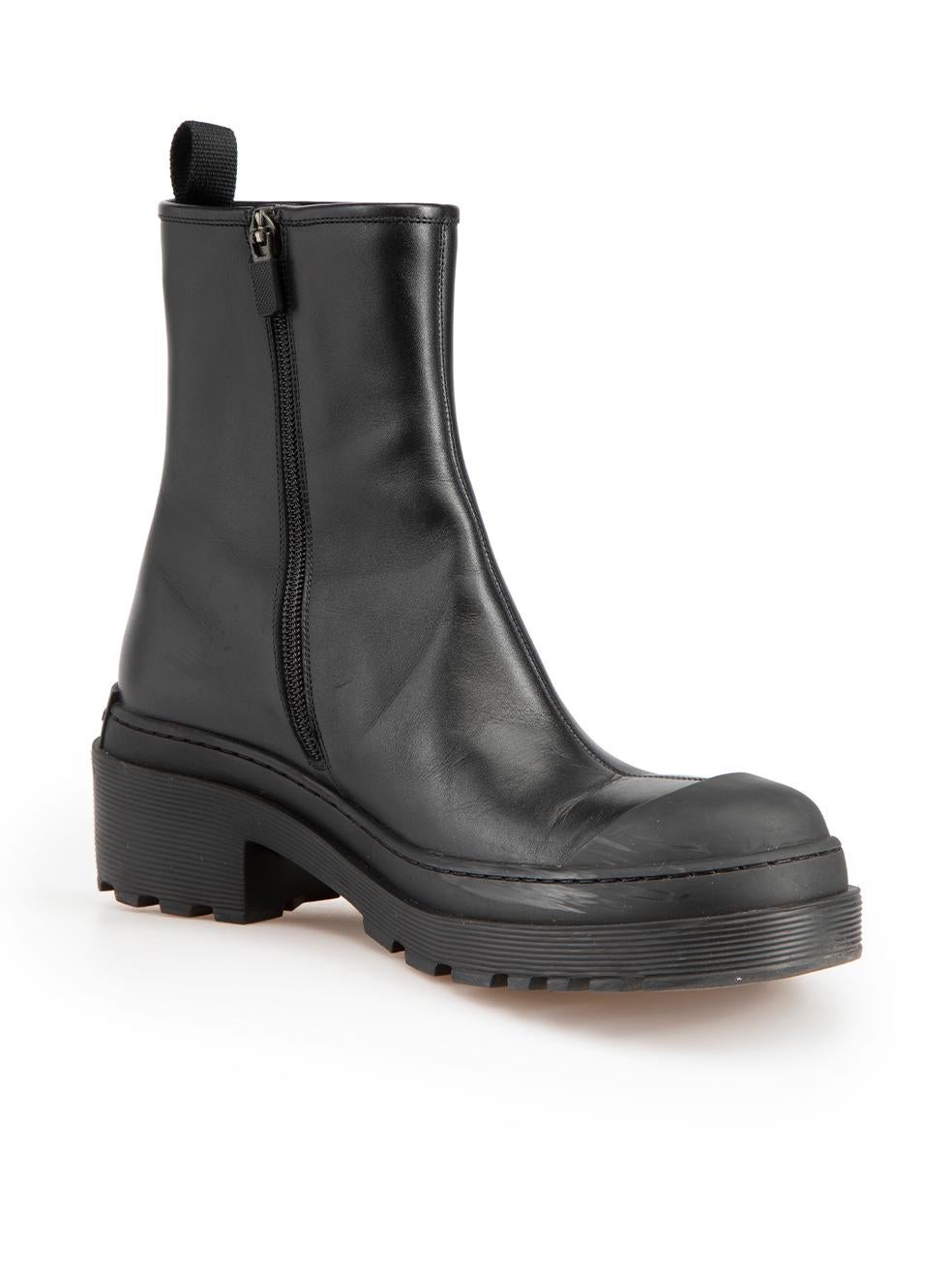 CONDITION is Very good. Minimal wear to boots is evident. Minimal wear to both boot trims and toe caps with abrasions to the rubber, as well as scratches to the leather at the left-side of both boots on this used Dior designer resale