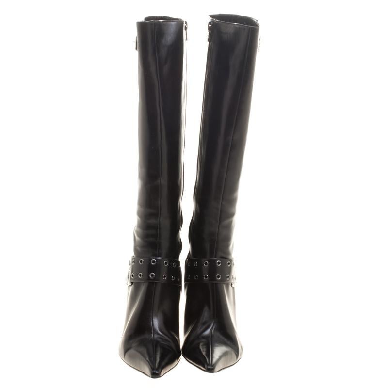 Creations as fashionable as this pair of knee high boots from Dior deserves to be in every woman's closet. They've been created from leather and designed with pointed toes, buckle straps with eyelets and 9 cm heels.

Includes: Original Dustbag

The