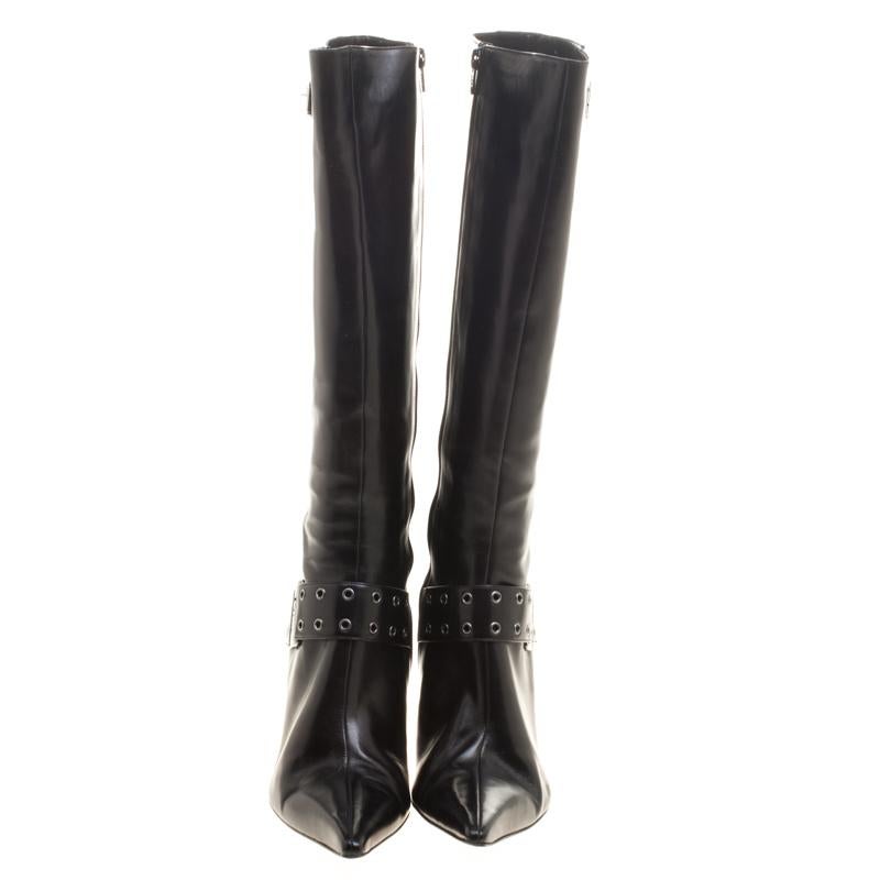 Creations as fashionable as this pair of knee high boots from Dior deserves to be in every woman's closet. They've been created from leather and designed with pointed toes, buckle straps with eyelets and 9 cm heels.

Includes: Original Dustbag

