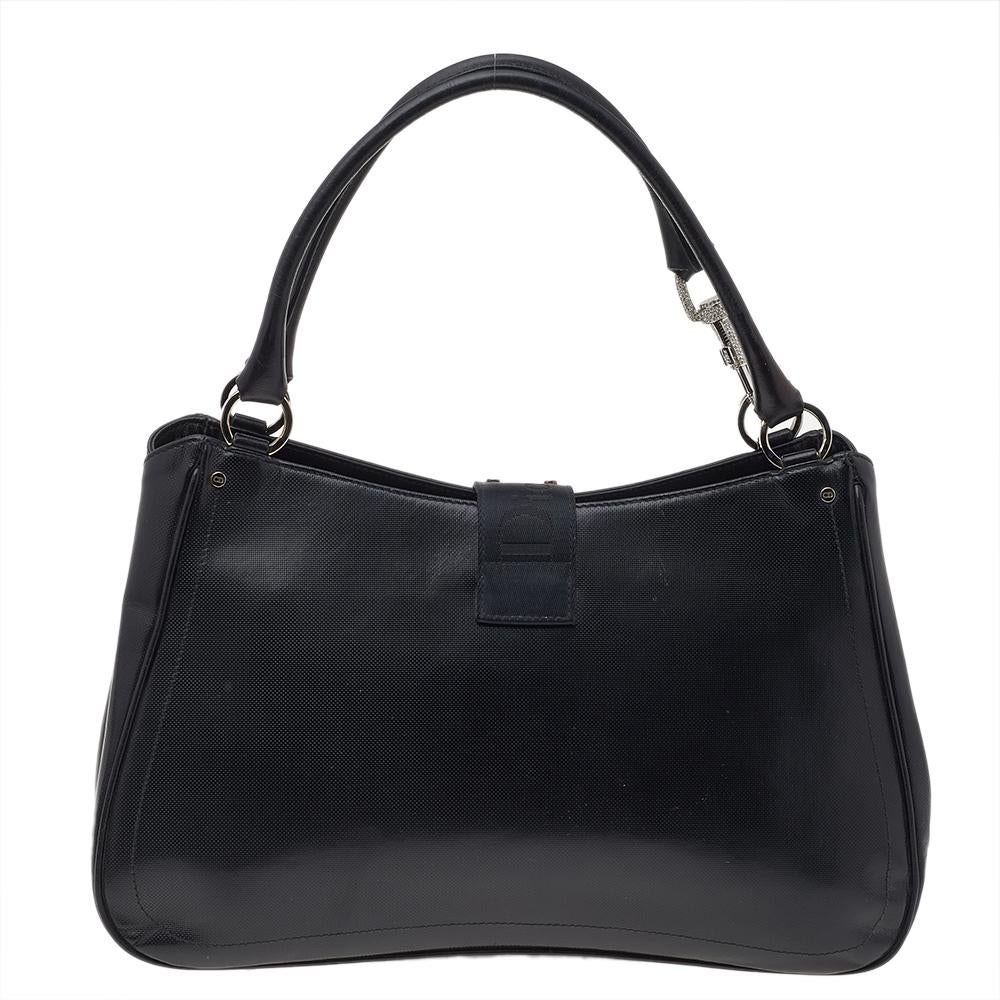 This Hardcore bag is all you need to stay glamorous without going overboard. It comes with a fabric and leather body designed in a structured silhouette with front flap closure and dual handles. A silky-soft lining of fabric lends a grand touch to