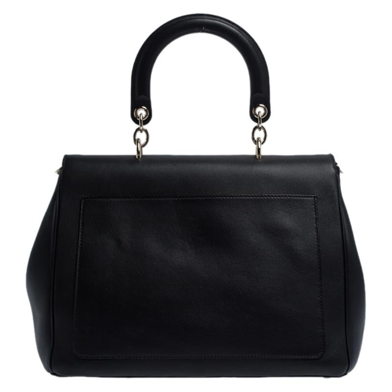 You're sure to stand out in the crowd when you carry a Dior handbag that lets you make a marvellous style statement. Crafted in Italy, this Be Dior bag has been made from quality leather. It carries a lovely shade of black. It is styled to deliver