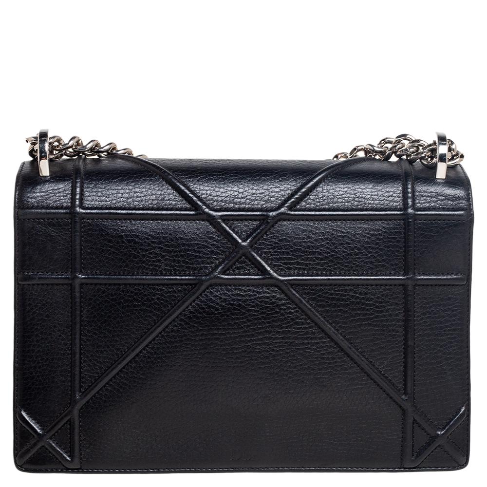 Crafted from leather with a Cannage pattern, this Dior Diorama bag embodies skillful craftsmanship. The suede-lined interior has enough room to neatly hold your evening valuables and the bag features silver-tone hardware. Held by a chain-leather