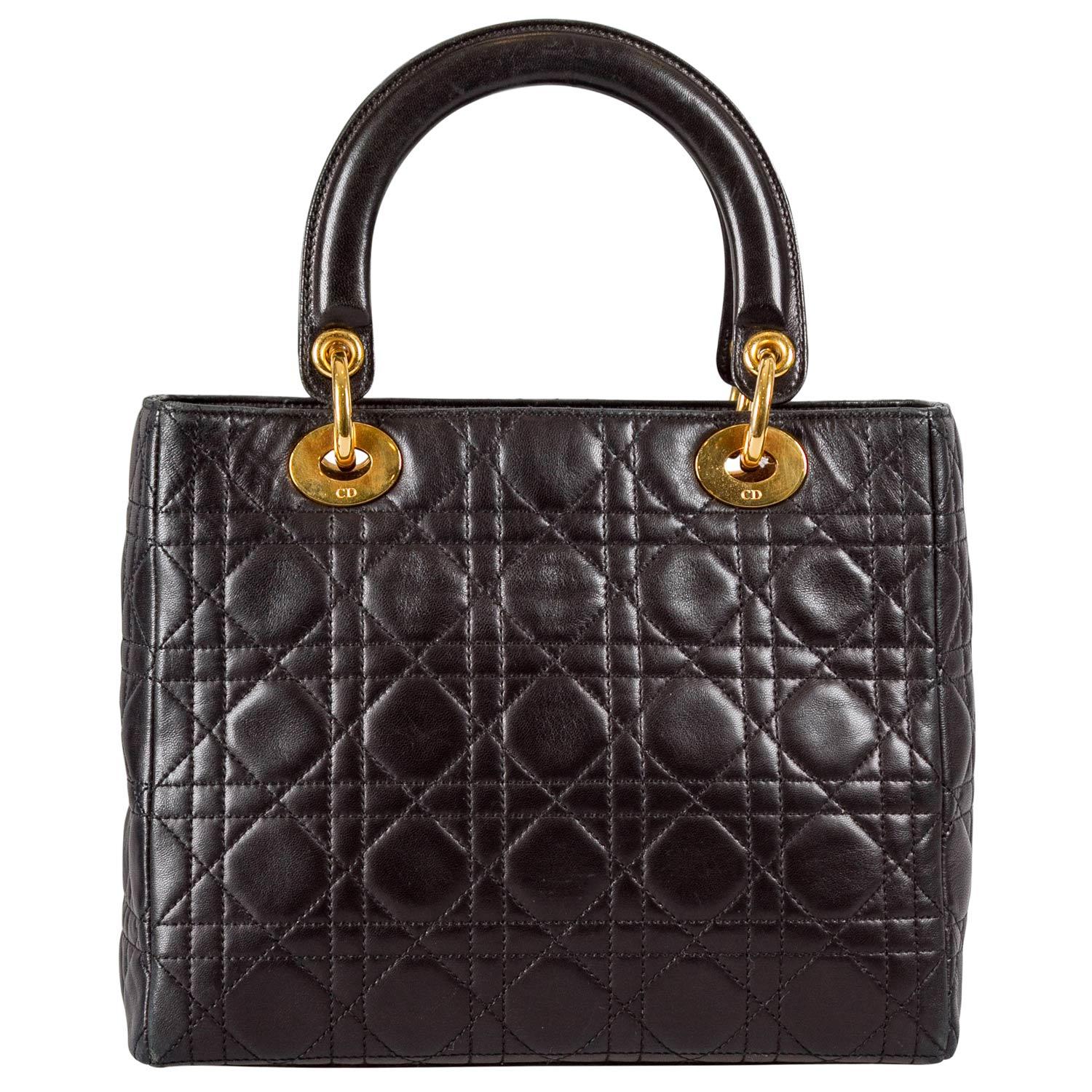 The Lady Dior tote from Dior is iconic, highly coveted, and since its birth in 1994, it has swayed us with its shape, design, and beauty. This version is a joy to witness! It comes meticulously crafted from black leather and designed with their