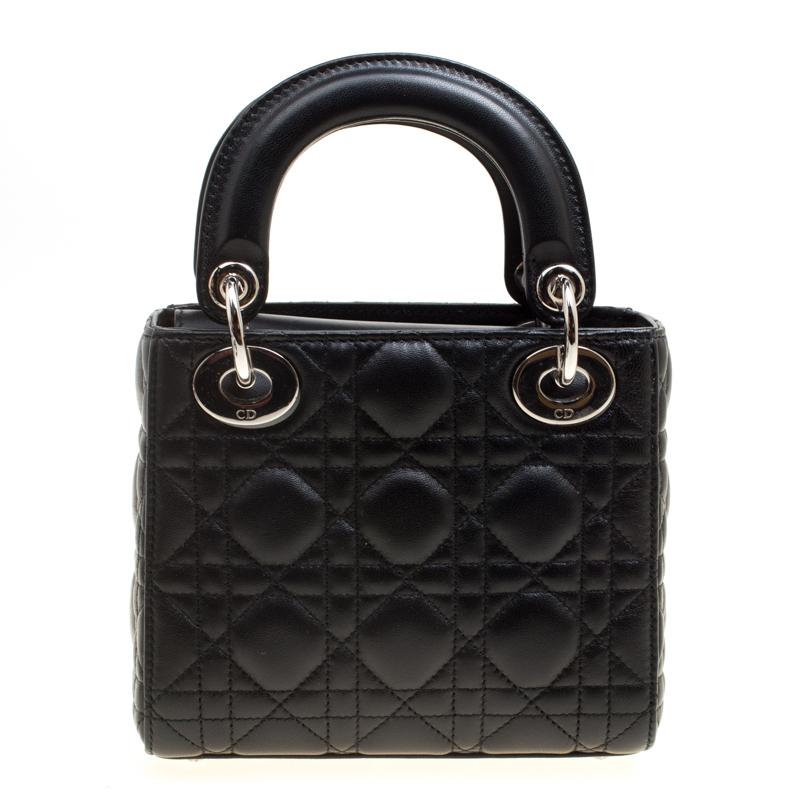 The Lady Dior tote is a Dior creation that has gained recognition worldwide and is today a coveted bag that every fashionista craves to possess. This black tote has been crafted from leather, and it carries the signature Cannage quilt all over its