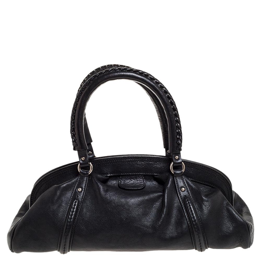 A special bag by Dior just for you. This gorgeous bag, sewn perfectly, is covered in black. It is constructed very carefully using leather. Inside the leather interior, there is just enough space to house the essentials you would require. Shapely