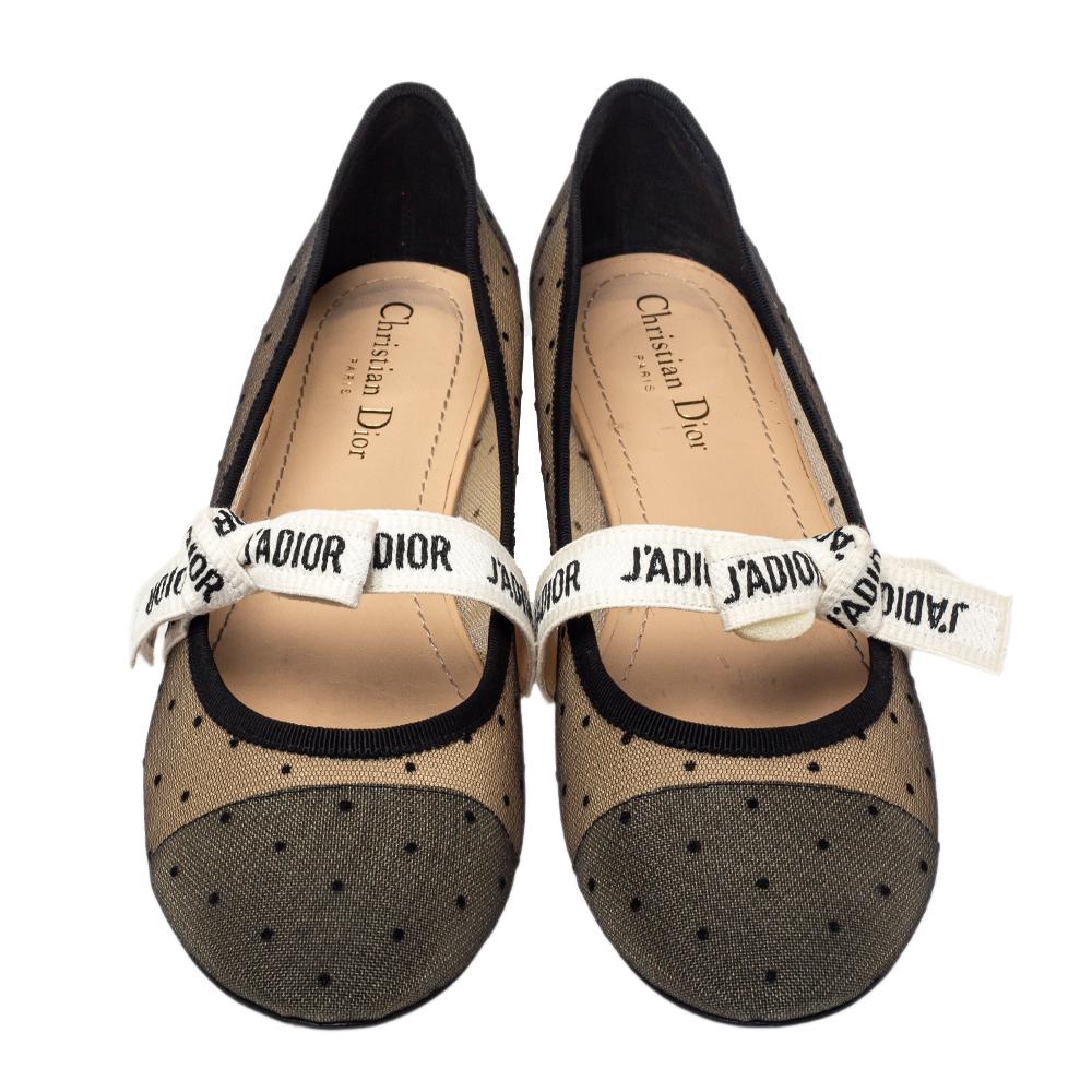 Endless compliments will come your way every time you wear these Dior ballet flats. The black flats are crafted from dotted mesh and styled with round toes and 'J'Adior' bow ribbons on the vamps. They are complete with comfortable leather-lined