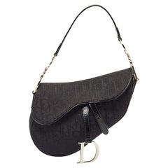 Dior Schwarze schräge Satteltasche aus Segeltuch und Lackleder