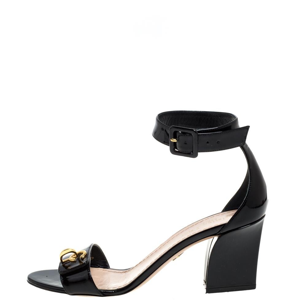 This beautiful pair of black sandals will be a loved buy. Exuding style and comfort, these sandals by Dior are perfect to be paired with any outfit of your choice. They are crafted from patent leather and detailed with ankle fastening and CD details
