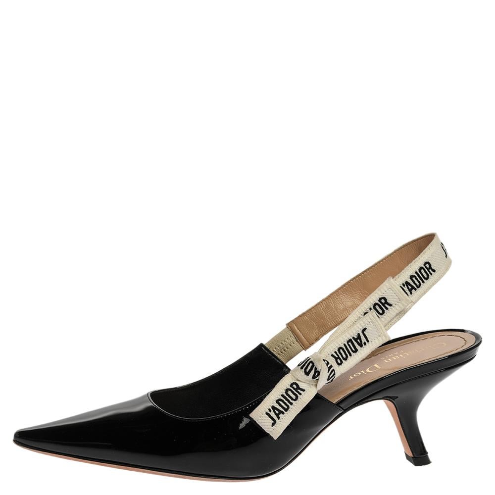 You'll definitely gather admiration wherever you go when you step out in these lovely pumps from Dior. The black pair is crafted from patent leather and feature pointed toes and J'adior ribbon slingbacks. The pumps are complete with comfortable