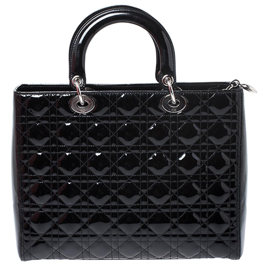 The Lady Dior tote is a Dior creation that has gained recognition worldwide and is today a coveted bag that every fashionista craves to possess. This black tote has been crafted from patent leather and it carries the signature Cannage quilt. It is