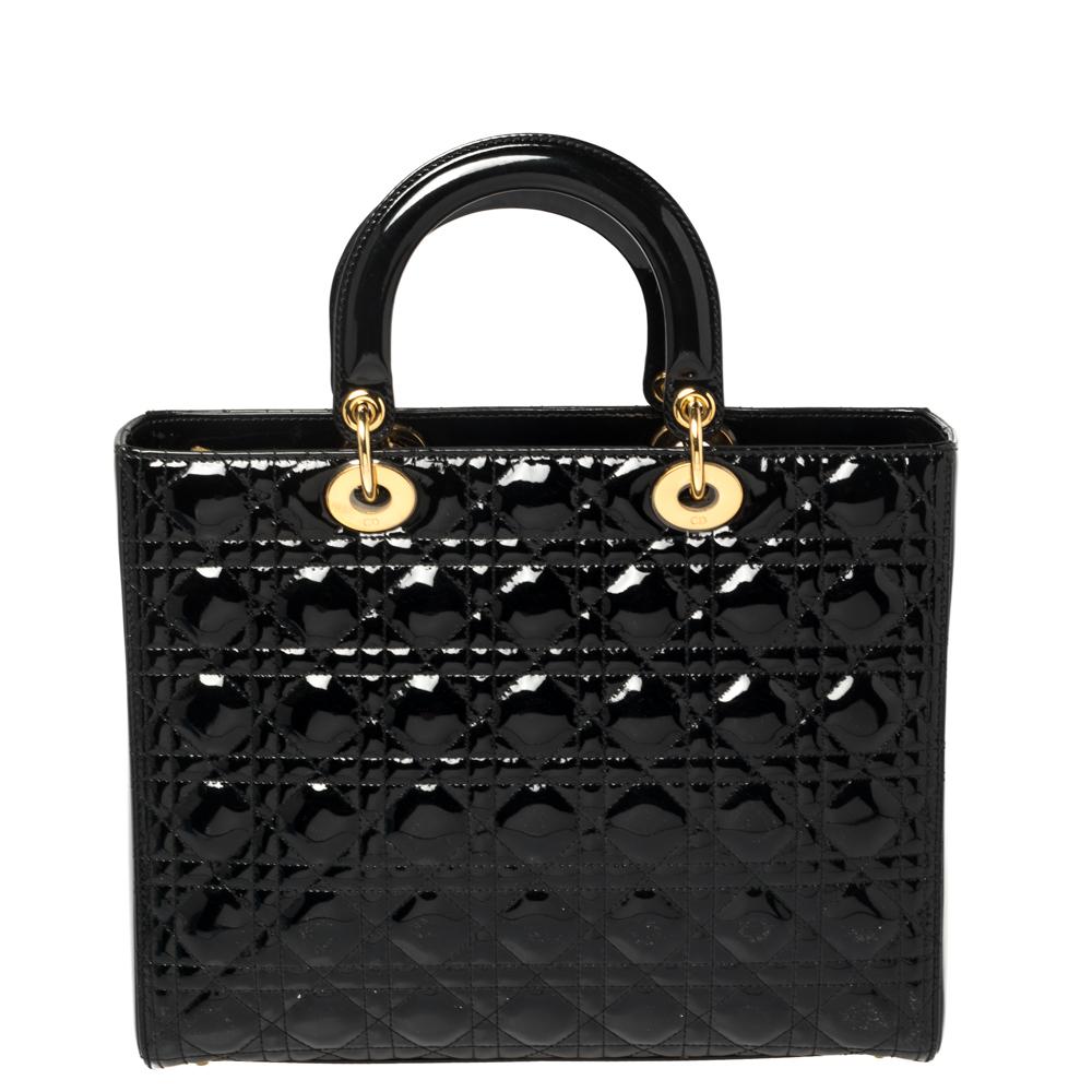 The Lady Dior tote is a Dior creation that has gained recognition worldwide and is today a coveted bag that every fashionista craves to possess. This black tote has been crafted from patent leather and it carries the signature Cannage quilt. It is