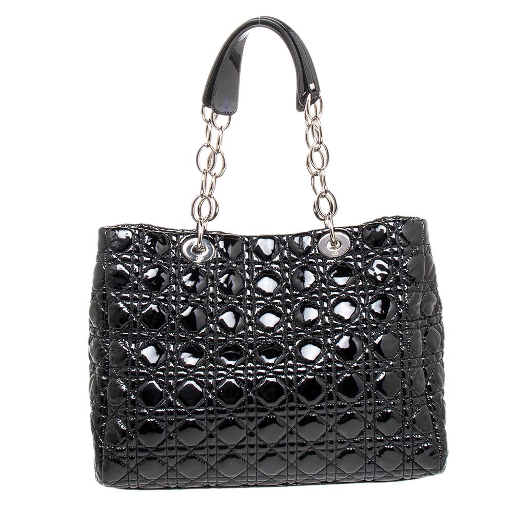 The Lady Dior tote is a Dior creation that has gained recognition worldwide and is today a coveted bag that every fashionista craves to possess. This black tote has been crafted from patent leather and it carries the signature Cannage quilt. It is
