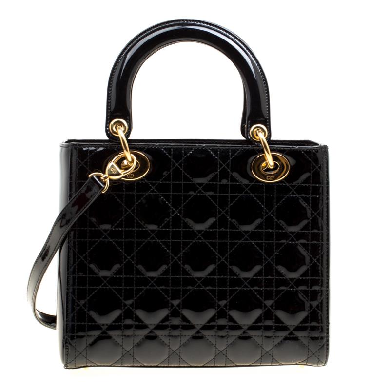 The Lady Dior bag from Dior is remarkable, highly coveted, and since its birth in 1994, it has swayed us with its shape, design, and beauty. This black version is a joy to witness! It comes meticulously crafted from patent leather and designed with