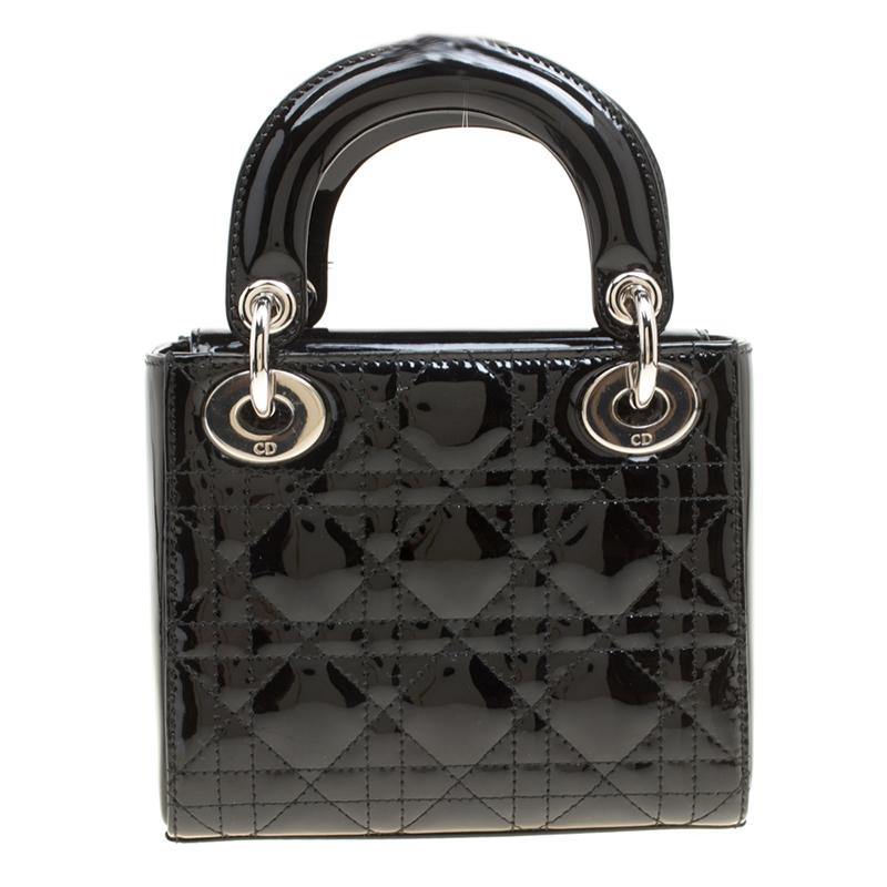 The Lady Dior tote is a Dior creation that has gained recognition worldwide and is today a coveted bag that every fashionista craves to possess. This black tote has been crafted from patent leather, and it carries the signature Cannage quilt all