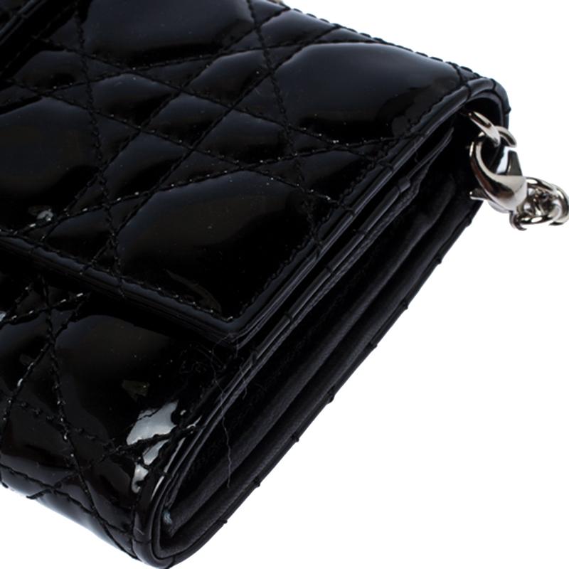 Clutches like this Miss Dior will never go out of style. Crafted from patent leather, this Dior bag features a black Cannage exterior and a chain strap. The front flap has a Dior lock that opens to a nylon-lined interior with enough space to keep