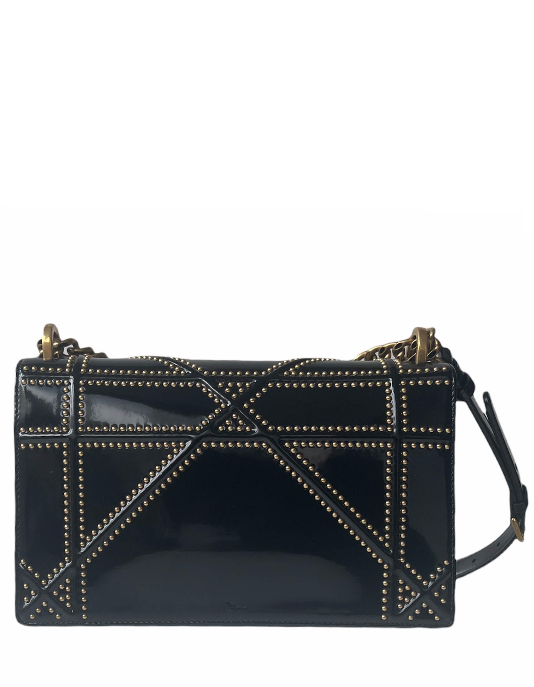 Dior Black Patent Leather Studded Medium Diorama Flap Bag

Made In: Italy
Year of Production: 2017
Color: Black
Hardware: Goldtone
Materials: Patent leather and metal
Closure/Opening: Flap top with push-lock
Exterior Pockets: None
Interior Pockets: