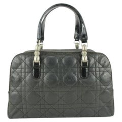 Dior - Sac Boston en cuir matelassé cannage perforé noir 549da611