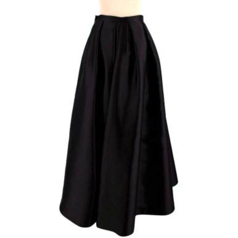 Dior Black Pleated Silk Asymmetric Skirt

	Long black pleated A line puff skirt
-zip pocket
-zip front
-pleated at waist band
-concealed clip front
-Tiered front
-double lined

Material
71% silk
29% polyester

Washing
Dry clean

MADE IN