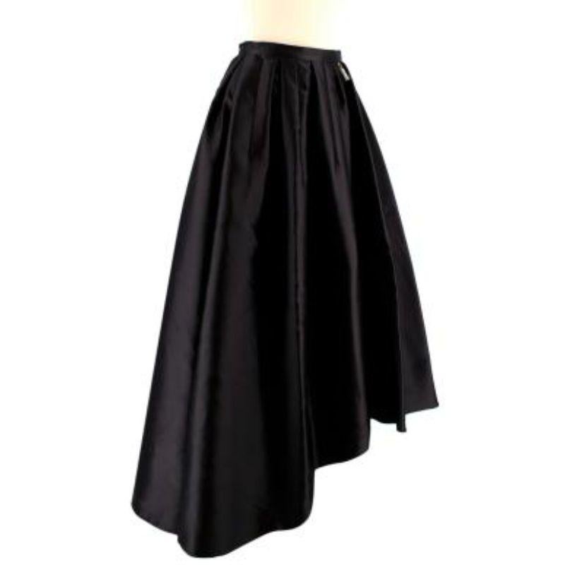 Dior Black Silk Asymmetric Pleated Full Skirt

-zip pocket
-zip front
-pleated at waist band 
-concealed clip front
-Tiered front 
-double lined

Material
71% silk
29% polyester

Washing
Dry clean

MADE IN FRANCE 

PLEASE NOTE, THESE ITEMS ARE