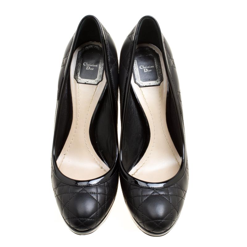 Go classy with these pumps from Dior. Crafted from black leather in their signature Cannage pattern, they feature round toes and 12.5 cm heels. Feminine and chic, these pumps will cut an alluring profile.

Includes: The Luxury Closet Packaging

