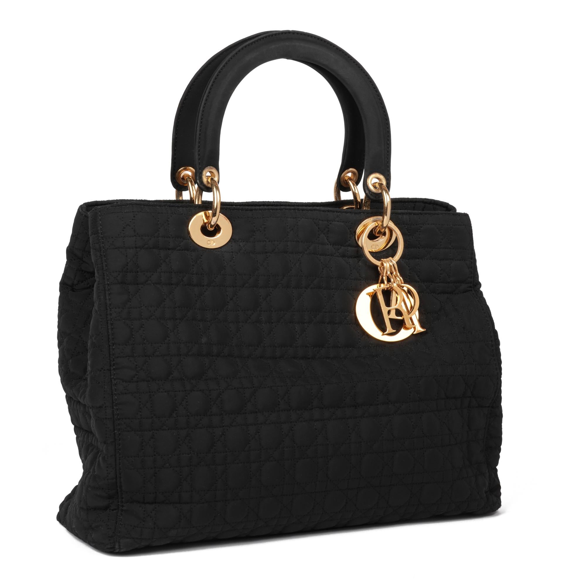 Dior
Black Quilted Nylon Vintage Large Lady Dior

Xupes Reference: HB5199
Serial Number: X
Age (Circa): 1995
Authenticity Details: (Made in Italy)
Gender: Ladies
Type: Tote

Colour: Black
Hardware: Gold
Material(s): Nylon
Interior: Red