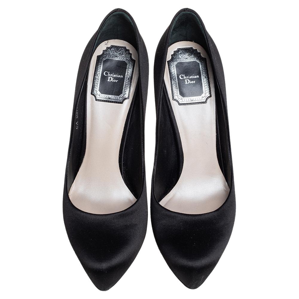 You can never go wrong with these Miss Dior pumps. They have been crafted from luxurious satin, they come in a lovely shade of black. They have low platforms, pointed toes and 11 cm heels. They are finished with leather soles.

